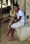 Bangladesh - Kaptai lake: Chakma man and his pipe (photo by Galen Frysinger)