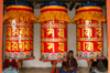 Bhutan - Thimphu - large red prayer wheels in the National Memorial Chorten - photo by A.Ferrari