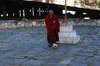 Bhutan - Paro: monk playing football - outside the Paro Dzong - photo by A.Ferrari