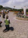 Bosnia-Herzegovina - Medugorje: pilgrims on her knees praying (photo by J.Kaman)