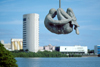 Brazil / Brasil - Recife / REC (Pernambuco): monument to the victims of torture, looks like an acrobat - statue - art - view of Recife island from Rua da Aurora - Djaci Falco building / Monumento Tortura Nunca Mais - edifco Djaci Falco - photo by Francisca Rigaud