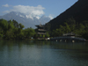 Lijiang, Yunnan Province, China: Dragon Park - pond, pagoda, bridge and mountains - photo by M.Samper