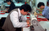 Dongguan, Guangdong province, China: seamster using a sewing machine - Chinese factory worker - photo by B.Henry