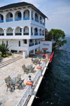 Goma, Nord-Kivu, Democratic Republic of the Congo: tables on Lake Kivu waterfront - Kap Kivu Hotel - Marinette Express docking area, boat service to Bukavu - photo by M.Torres