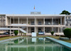 Brazzaville, Republic of Congo: City Hall - Hotel de Ville / Mairie - facade and pond seen from the gardens - French Colonial Architecture by Jean Yves Normand - Mairie Centrale de Brazzaville - Pierre Savorgnan de Brazza Memorial on the left - Avenue Amilcar Cabral, Quartier de la Plain, Poto-Poto - photo by M.Torres