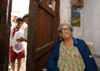 Cuba - Holgun - 90-year-old grandmother and pioneer with baloon - photo by G.Friedman