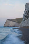 Durdle Door beach, Dorset, England: wave and the cliffs of the Jurassic Coast - UNESCO World Heritage Site - photo by I.Middleton