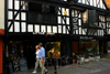 Canterbury, Kent, South East England: St Peter's Street - people walking past Little Italy restaurant - photo by I.Middleton