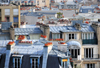 Paris, France: mansard roofs and chimneys with red pipes of Montmartre district, 18e arrondissement - photo by M.Torres