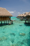 Papetoai, Moorea, French Polynesia: InterContinental Hotel - overwater bungalows - emerald waters of a South Pacific Ocean lagoon - photo by D.Smith