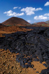 Bartolom Island, Galapagos Islands, Ecuador: lava field and small volcano - photo by C.Lovell