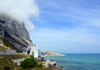 Gibraltar: view along Sir Herbert Miles Road towards Catalan Bay - orographic clouds, Caleta Hotel and newly reclaimed land - photo by M.Torres