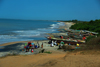 Praia de Varela / Varela beach, Cacheu region, Guinea Bissau / Guin Bissau: View from the beach, traditional fishing boats, men and women gutting the fish / paisagem da praia, barcos de pesca tradicional, homens e mulheres a arranjar o peixe - photo by R.V.Lopes