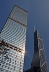 Hong Kong: Cheung Kong Centre - skyscraper by Cesar Pelli, Central - sun on the curtain wall - Bank of China on the right - photo by M.Torres