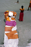 India - Uttaranchal - Rishikesh: clothes of pilgrims bathing in the Ganges - photo by W.Allgwer