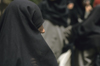 Iran: a black chador in the crowd - photo by W.Allgower