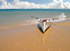 Israel - Kibbutz Sdot Yam: lonely boat - beach - photo by Efi Keren