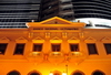 Macau, China: faade of the Banco Nacional Ultramarino building at night - colonial architecture - photo by M.Torres