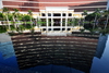 Macau, China: Wynn Macau luxury hotel and casino resort reflected in the fountain pond - Cidade de Sintra Street - photo by M.Torres