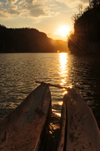 Antsalova district, Melaky region, Mahajanga province, Madagascar: Manambolo River - double dugout canoe and the rising sun - photo by M.Torres