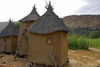 Bandiagara Escarpment, Dogon country, Mopti region, Mali: Dogon granaries with the cliffs in the background - photo by J.Pemberton