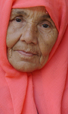 Morocco / Maroc - the bread lady - pink headscarf - photo by J.Banks