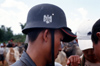 Myanmar - Heho - Shan State: man with in the market with German Wehrmacht helmet - Stahlhelm - photo by W.Allgwer - Ein junger Burmese trgt die Nachbildung eines Wehrmachtshelms auf dem Wasserbffel-Markt. Der Markt in Heho findet alle fnf Tage statt. E