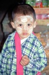 Myanmar / Burma - Nyaungshwe: boy with traditional face painting (photo by J.Kaman)