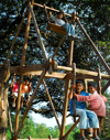 Pokhara, Nepal: children playing on a festival wood swing - photo by E.Petitalot