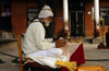 Narayanthan village, Kathmandu valley, Nepal: Budhanilkantha temple - Brahmin priest reading - Brahmins are the highest caste (Varna) - Brahmins are priests, but also teachers and scholars of the Veda - photo by W.Allgwer