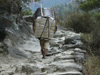 Marsyangdi Valley, Manang district, Gandaki Zone, Nepal: cargo - porter climbing - Annapurna Circuit - photo by M.Samper