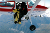 New Zealand - South island: West Coast - Tandem Parachute Jump - in flight - Ready to jump - Glacier Skydive - photo by Air West Coast