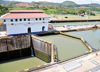 Panama Canal: Miraflores locks - notice the huge difference in levels between locks - hydraulically operated miter gates - Esclusas de Miraflores - each lock is 110 feet wide by 1000 feet long - photo by M.Torres