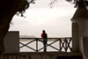 Panama City: a man looks at Panama Bay towards the Amador Area - guerite at Plaza de Francia, Casco Viejo - photo by H.Olarte