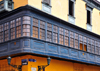 Lima, Peru: long wooden balcony at the corner of Conde de Superunda and Caman streets - photo by M.Torres