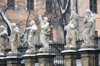 Poland - Krakow: statues in front of St. Barbara's church - sunrise - photo by M.Gunselman