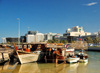 Doha, Qatar: dhows wait in the Dhow harbour - view of the south end of the Corniche from the Ministry of Finance to the Sultan Bin Abdullah Al-Asiri tower - photo by M.Torres