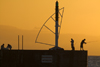 Saint Gilles, Runion: harbour at sunset - anglers on the pier - photo by Y.Guichaoua