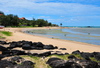 Anse Mourouk, Rodrigues island, Mauritius: sand and black boulders at Anse Mourouk beach - photo by M.Torres