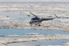 Russia - Bering Strait (Chukotka AOk): MI-2 helicopter ferries passengers - photo by R.Eime