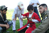 Chechnya, Russia - boy assembling a pistol - wearing Chechen national costume with a dagger - photo by A.Bley