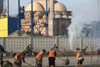 Chechnya, Russia - Grozny - Chechens sweep the street in front of mosque construction site - photo by A.Bley