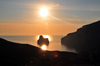 Porto Flavia, Masua, Sardinia / Sardegna / Sardigna: Pan di Zucchero islet at sunset - part of a marine park - jagged coastline of the Gonnesa gulf - Sulcis Iglesiente region - Tramonto sul Pan di Zucchero - photo by M.Torres