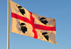 Cagliari, Sardinia / Sardegna / Sardigna: Sardinian flag in the harbour - white field with red cross and a moor's head on each canton - photo by M.Torres