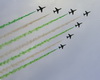 Riyadh, Saudi Arabia: Saudi Hawks aerobatic team flying BAE Hawk Mk.65 jet trainers flying in formation and releasing green smoke - Royal Saudi Air Force - photo by M.Torres