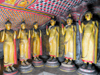 Dambulla, Central Province, Sri Lanka: six Buddhas stand in a corner - Maha Alut Vihara cave - Dambulla cave temple - UNESCO World Heritage Site - photo by M.Torres