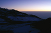 70 Tanzania - Kilimanjaro NP: Marangu Route - day 5 - Mount Kilimanjaro, the Kibo snow and clouds in the early morning light - photo by A.Ferrari