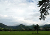 Trinidad - Port of Spain: clouds and soccer fields - photo by P.Baldwin