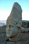 Mt Nemrut National Park / Nemrut Dagi / Mount Nimrod / iyay Nemrud, Adiyaman province, Southeastern Anatolia, Turkey: Commagene king Antiochus I - statue with tall head-gear - Western Terrace - photo by C. le Mire