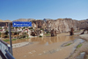 Hasankeyf / Heskif, Batman Province, Southeastern Anatolia, Turkey: town sign on the new bridge - the Tigris river, the town and the ruins of the old bridge - photo by W.Allgwer